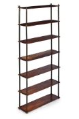 AN UNUSUAL FLIGHT OF MAHOGANY AND BRASS MOUNTED SHELVES, EARLY 19TH CENTURY