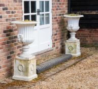 A LARGE PAIR OF CAST IRON URNS, 19TH CENTURY