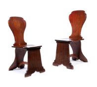 A PAIR OF GEORGE II MAHOGANY 'SGABELLO' HALL CHAIRS, CIRCA 1740