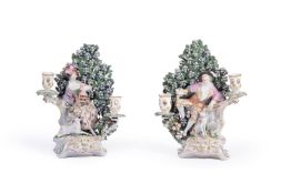 A PAIR OF DERBY FIGURAL TWO-BRANCH CANDLESTICKS OF A SHEPHERD AND SHEPHERDESS, CIRCA 1770