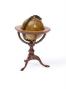 A SMALL DESK GLOBE, THE 'NEW GLOBE OF THE EARTH' BY DUDLEY ADAMS, 1808