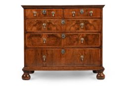 A WILLIAM & MARY FIGURED WALNUT AND FEATHER BANDED CHEST OF DRAWERS, CIRCA 1690