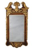 A GEORGE II WALNUT AND PARCEL GILT MIRROR, CIRCA 1740