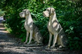 A PAIR OF LARGE STONE COMPOSITION MODELS OF SEATED GREAT DANES, 20TH CENTURY