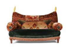 A VICTORIAN WALNUT SOFA UPHOLSTERED IN TURKEY WORK, CIRCA 1880