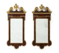 A PAIR OF MAHOGANY AND PARCEL GILT MIRRORS, IN GEORGE II STYLE, EARLY 20TH CENTURY