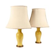 A PAIR OF YELLOW CRACKLE GLAZED AND GILT METAL MOUNTED LAMPS, 20TH CENTURY