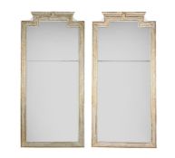 A PAIR OF CREAM PARCEL GILT TRUMEAU MIRRORS, 20TH CENTURY