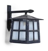 AN ARTS & CRAFTS PATINATED METAL AND GLAZED WALL MOUNTED LANTERN, EARLY 20TH CENTURY