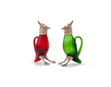 A PAIR OF SPANISH SILVER COLOURED MOUNTED AND COLOURED GLASS BIRD DECANTERS