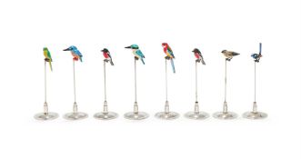A SET OF SIX SILVER COLOURED AND ENAMEL BIRDS ON STANDS