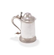 A GEORGE III SILVER TANKARD