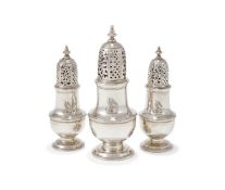 A SET OF THREE GEORGE II SILVER SUGAR CASTERS