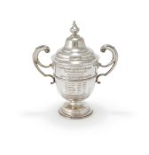 AN EDWARDIAN SILVER CUP AND COVER