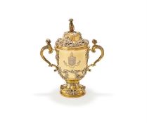 AN EDWARDIAN SILVER GILT CUP AND COVER