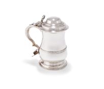 A GEORGE III SILVER BALUSTER TANKARD