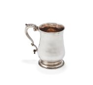 A GEORGE III SILVER BALUSTER TANKARD