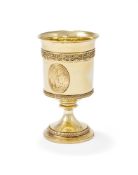 A GEORGE III SILVER GILT PEDESTAL CUP
