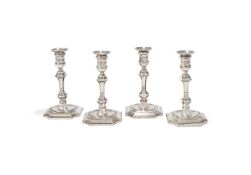 A MATCHED SET OF FOUR VICTORIAN SILVER CANDLESTICKS