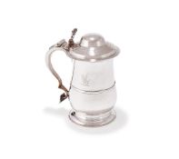 A GEORGE III SILVER BALUSTER TANKARD