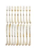 A SET OF NINE VICTORIAN SILVER PISTOL GRIPPED FORKS AND KNIVES