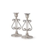 A PAIR OF SILVER LYRE FORM CANDLESTICKS