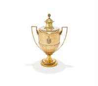 AN EDWARDIAN SILVER GILT CUP AND COVER