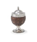 A GEORGE III SILVER MOUNTED COCONUT CUP AND COVER