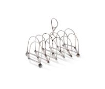A GEORGE III SILVER TELESCOPIC SIX DIVISION TOAST RACK