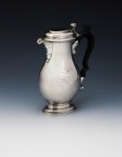 A GEORGE II SILVER BALUSTER SHAVING JUG