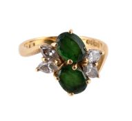 A GREEN TOURMALINE AND DIAMOND CROSSOVER RING