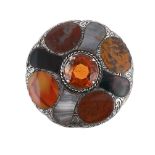 A VICTORIAN SCOTTISH HARDSTONE CIRCULAR BROOCH