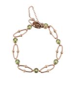 DEAKIN & FRANCIS, AN EARLY 20TH CENTURY PERIDOT BRACELET