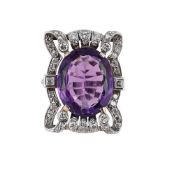 AN AMETHYST AND DIAMOND PANEL DRESS RING