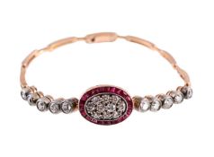 AN EARLY 20TH CENTURY DIAMOND AND SYNTHETIC RUBY BRACELET