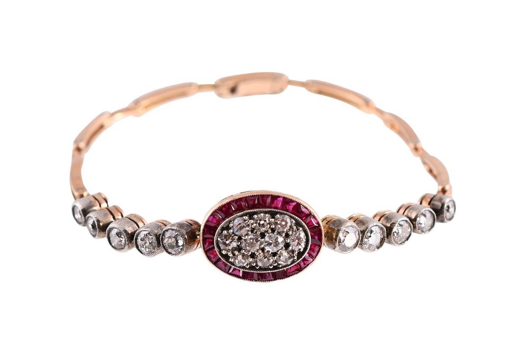 AN EARLY 20TH CENTURY DIAMOND AND SYNTHETIC RUBY BRACELET