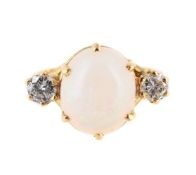 AN OPAL AND DIAMOND THREE STONE RING