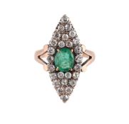 AN EMERALD AND DIAMOND NAVETTE CLUSTER RING