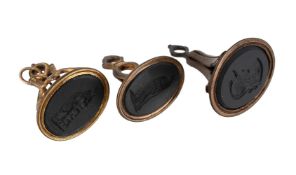 WEDGWOOD, NO. 396 AND 85, TWO LATE 18TH CENTURY BLACK BASALT FOB SEALS, AND ANOTHER
