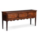 A GEORGE III OAK DRESSER BASE, CIRCA 1780