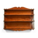 A REGENCY MAHOGANY AND BRASS MOUNTED FLIGHT OF WATERFALL WALL SHELVES, CIRCA 1820