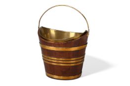 A MAHOGANY AND BRASS BOUND NAVETTE SHAPED BUCKET, 19TH CENTURY