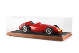 AN AMALGAM MODEL OF A MASERATI 250F IN A PERSPEX CASE, MODERN