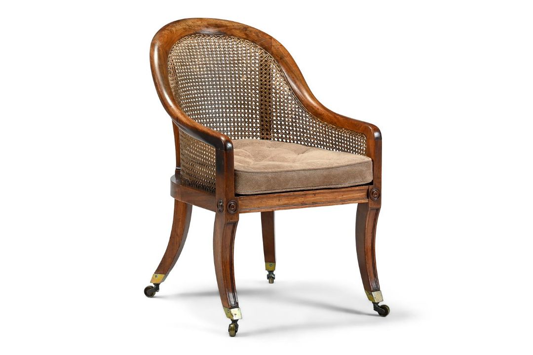 A REGENCY MAHOGANY AND CANED BERGERE ARMCHAIR IN THE MANNER OF GILLOWS, CIRCA 1820 - Image 1 of 2