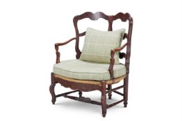 A PROVINCIAL WALNUT DOUBLE CHAIR BACK FAUTEUIL