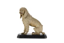 A CARVED AND PAINTED MODEL OF A SEATED POODLE LATE 19TH/EARLY 20TH CENTURY