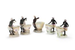 A MEISSEN FIGURAL SWEETMEAT EMBLEMATIC OF AFRICA FROM A SERIES OF THE FOUR CONTNENTS