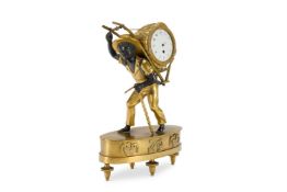 A SECOND EMPIRE GILT AND BRONZED METAL MANTLE TIMEPIECE
