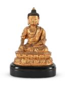 A Chinese gilt-bronze seated Buddha