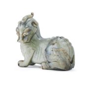 A Chinese celadon jade carving of a seated bixie
